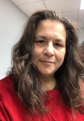 Portrait of female wearing a red shirt.