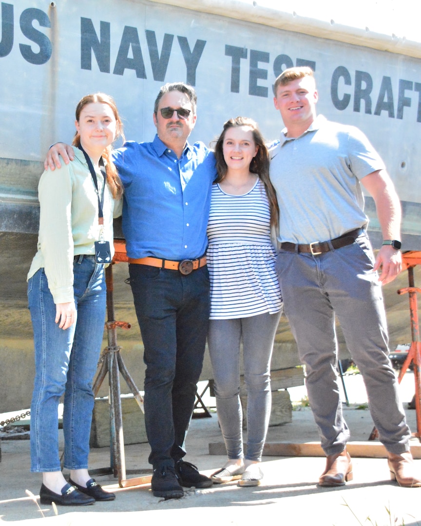 Naval Surface Warfare Center, Carderock Division employees from the Test and Evaluation Engineering Resource Branch after receiving the 2022 Department of Homeland Security Under Secretary of (S&T) Collaboration Award for their efforts in the planning and execution of the 47-foot Motor Life Boat Initial Operational Test and Evaluation. From left: Alice Freese, John Huber, Maeanna Stover and Philip Pullen. The photo was taken in Little Creek, Va., on Sept. 22, 2022. The award ceremony was held on Nov. 17. (Photo provided by John Huber)