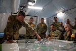Soldiers with the Louisiana National Guard’s 256th Infantry Brigade Combat Team plan and review the unit’s movements during Warfighter 23-2 at Camp Atterbury, Indiana, Nov. 8, 2022. The warfighter exercises provide virtual battlefield scenarios that test a unit’s staff and Soldiers’ ability to coordinate and communicate in functional skill areas such as command and control, movement and maneuver, intelligence, targeting processes, sustainment and protection.