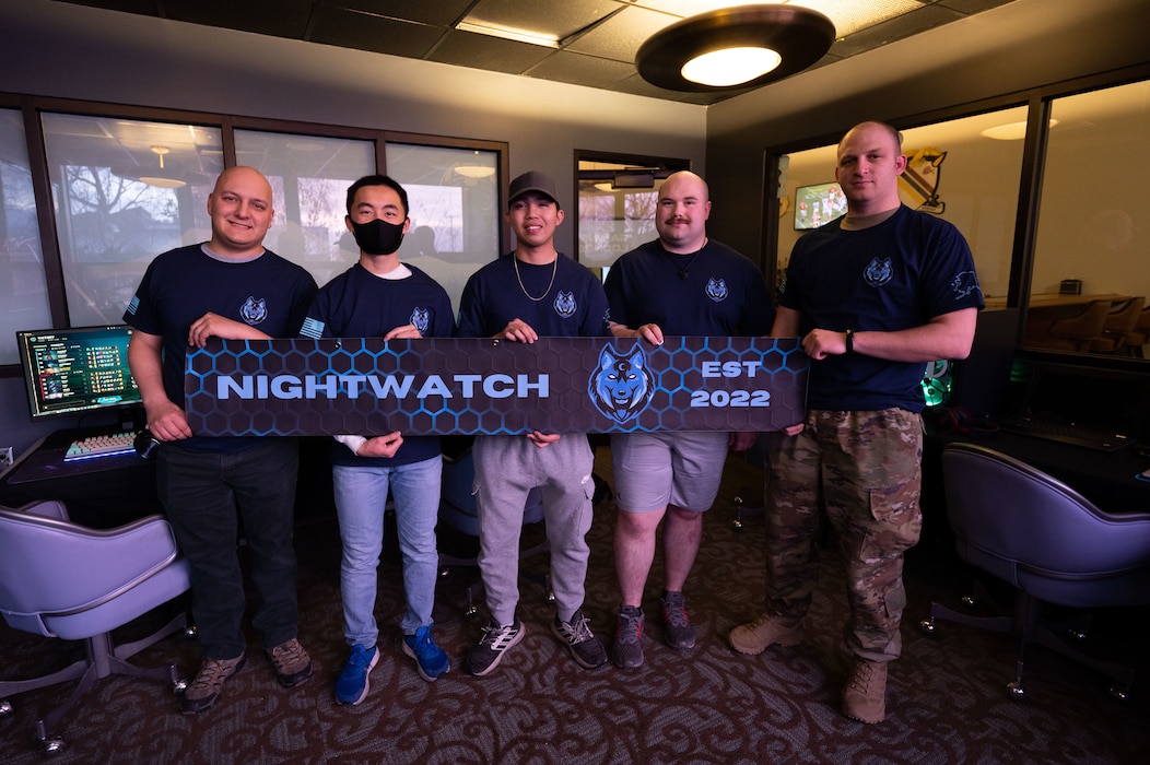 Members of the Nightwatch gaming team pose for a photo while competing in a gaming tournament on Eielson Air Force Base, Alaska, Oct. 13, 2022. Nightwatch allows casual and competitive gamers to come together to build camaraderie and morale for Airmen on base. (U.S. Air Force photo by Airman 1st Class Ricardo Sandoval)