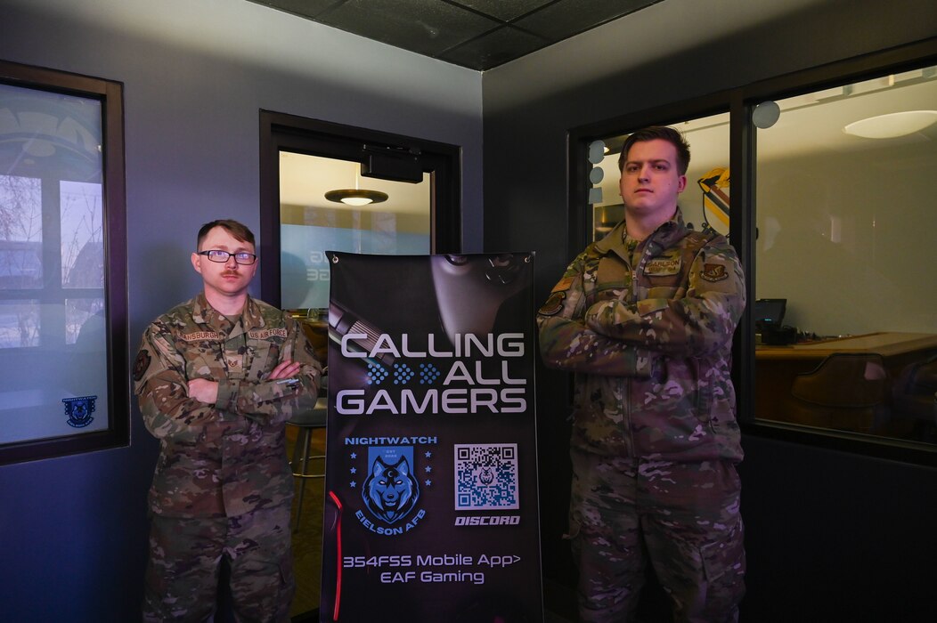 Members of the Nightwatch gaming team pose for a photo while competing in a gaming tournament on Eielson Air Force Base, Alaska, Oct. 13, 2022. Nightwatch allows casual and competitive gamers to come together to build camaraderie and morale for Airmen on base. (U.S. Air Force photo by Airman 1st Class Ricardo Sandoval)