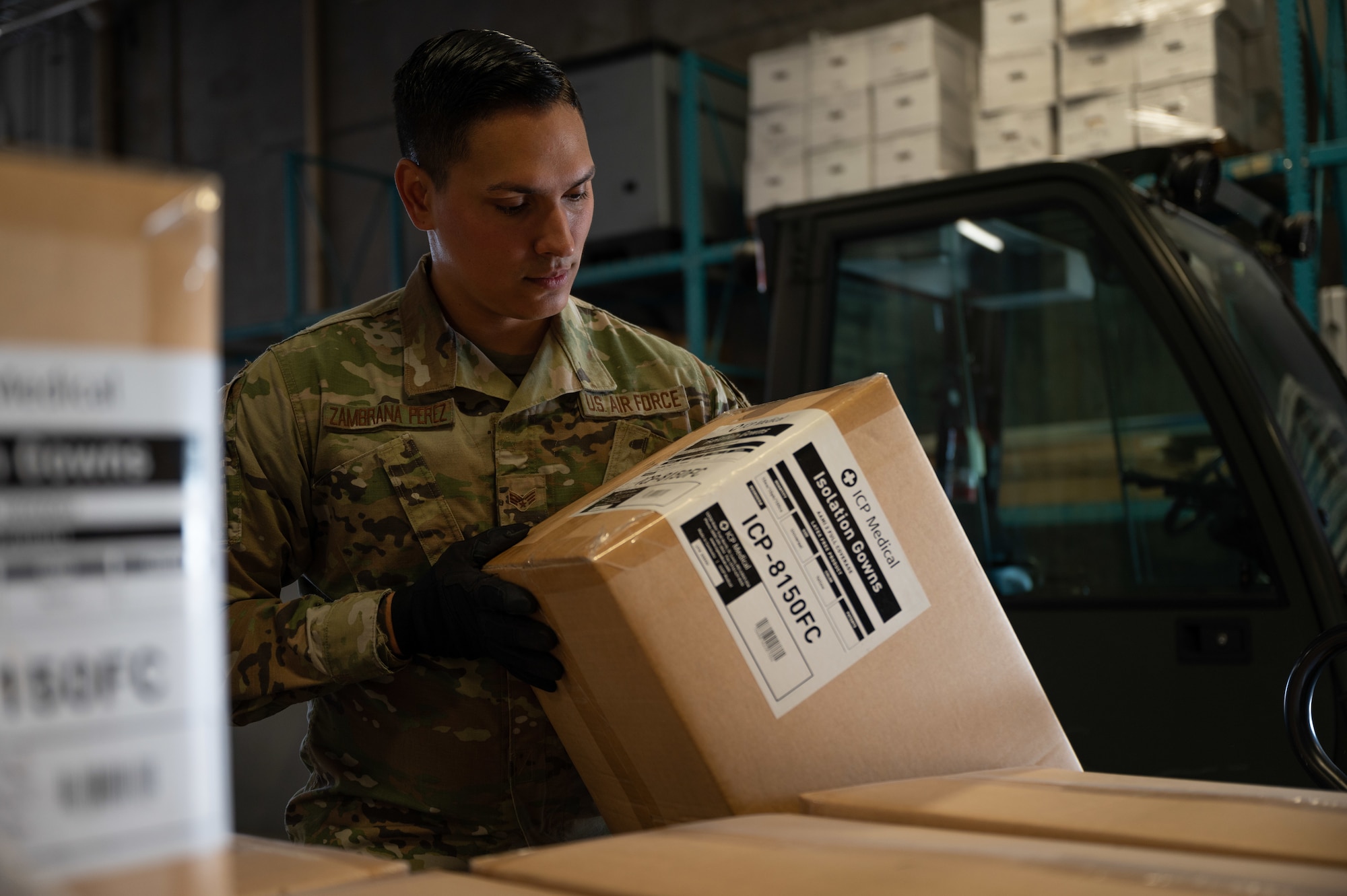 An Airman inspects a package