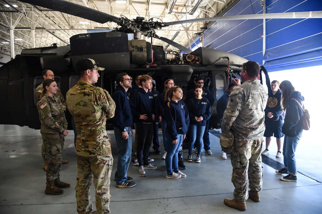 Junior ROTC cadets from Gloucester High School visit the Virginia National Guard’s Army Aviation Support Facility for a tour and information session Nov. 8, 2022, in Sandston, Virginia. The event, organized by recruiters from the Virginia Army National Guard’s Recruiting and Retention Battalion, included 18 naval JROTC cadets, all juniors and seniors, who received an overview of the U.S. Army and the capabilities of the Virginia National Guard’s Army aviation assets before touring the maintenance facility and a UH-60 Black Hawk helicopter. (U.S. Army National Guard photo by Sgt. 1st Class Terra C. Gatti)