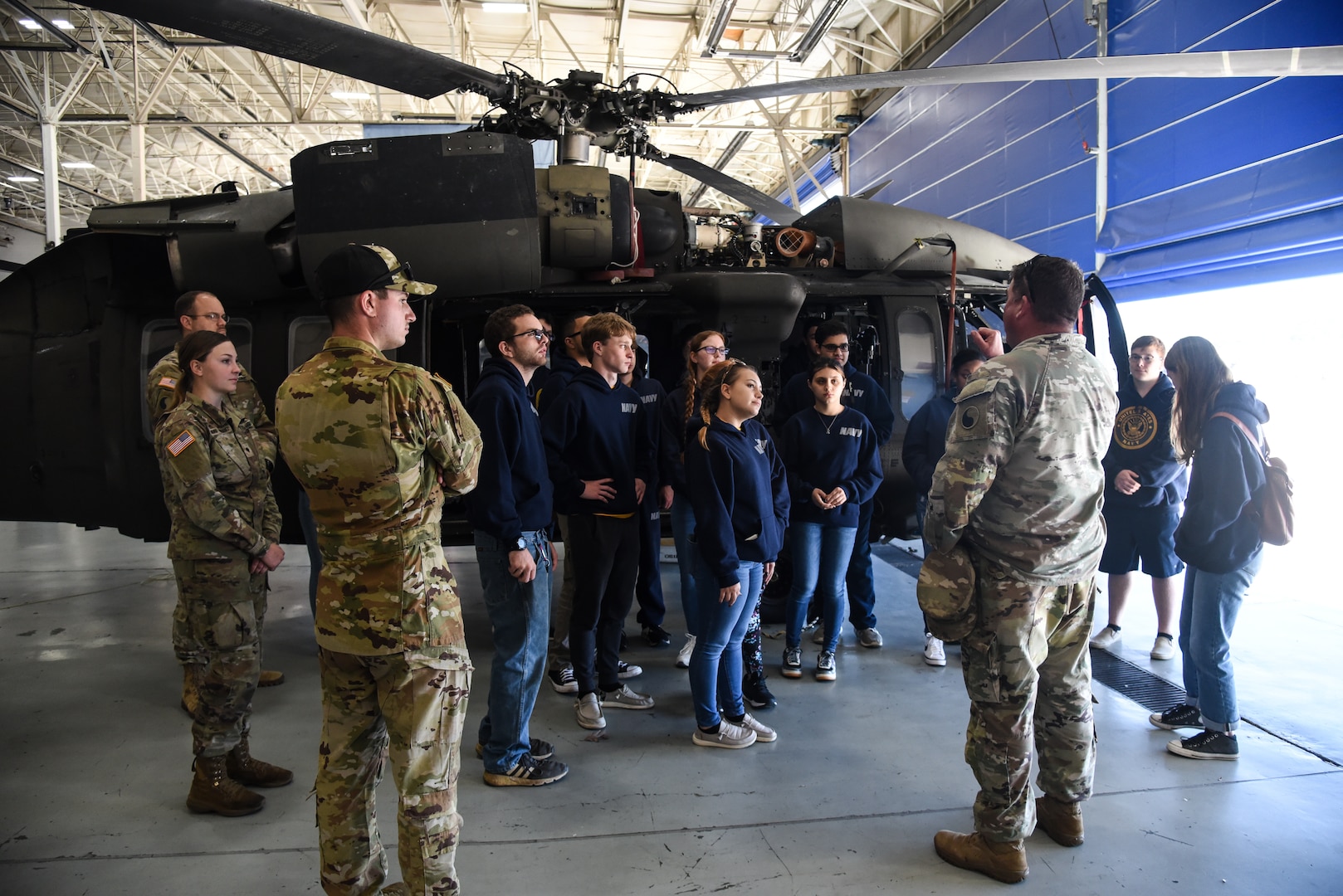 Junior ROTC cadets from Gloucester High School visit the Virginia National Guard’s Army Aviation Support Facility for a tour and information session Nov. 8, 2022, in Sandston, Virginia. The event, organized by recruiters from the Virginia Army National Guard’s Recruiting and Retention Battalion, included 18 naval JROTC cadets, all juniors and seniors, who received an overview of the U.S. Army and the capabilities of the Virginia National Guard’s Army aviation assets before touring the maintenance facility and a UH-60 Black Hawk helicopter. (U.S. Army National Guard photo by Sgt. 1st Class Terra C. Gatti)