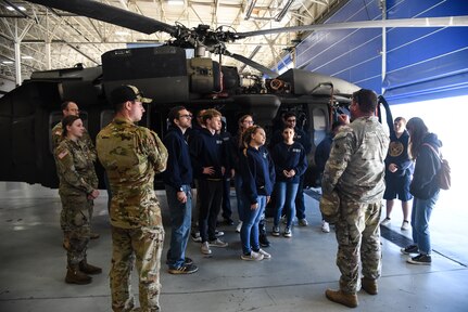 Junior ROTC cadets from Gloucester High School visit the Virginia National Guard’s Army Aviation Support Facility for a tour and information session Nov. 8, 2022, in Sandston, Virginia. The event, organized by recruiters from the Virginia Army National Guard’s Recruiting and Retention Battalion, included 18 naval JROTC cadets, all juniors and seniors, who received an overview of the U.S. Army and the capabilities of the Virginia National Guard’s Army aviation assets before touring the maintenance facility and a UH-60 Black Hawk helicopter. (U.S. Army National Guard photo by Sgt. 1st Class Terra C. Gatti)