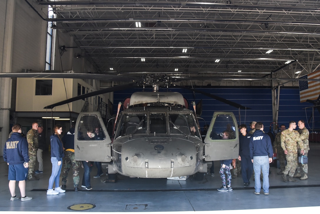 Junior ROTC cadets from Gloucester High School visit the Virginia National Guard’s Army Aviation Support Facility for a tour and information session Nov. 8, 2022, in Sandston, Virginia. The event, organized by recruiters from the Virginia Army National Guard’s Recruiting and Retention Battalion, included 18 naval JROTC cadets, all juniors and seniors, who received an overview of the U.S. Army and the capabilities of the Virginia National Guard’s Army aviation assets before touring the maintenance facility and a UH-60 Black Hawk helicopter. (U.S. Army National Guard photo by Sgt. 1st Class Terra C. Gatti)