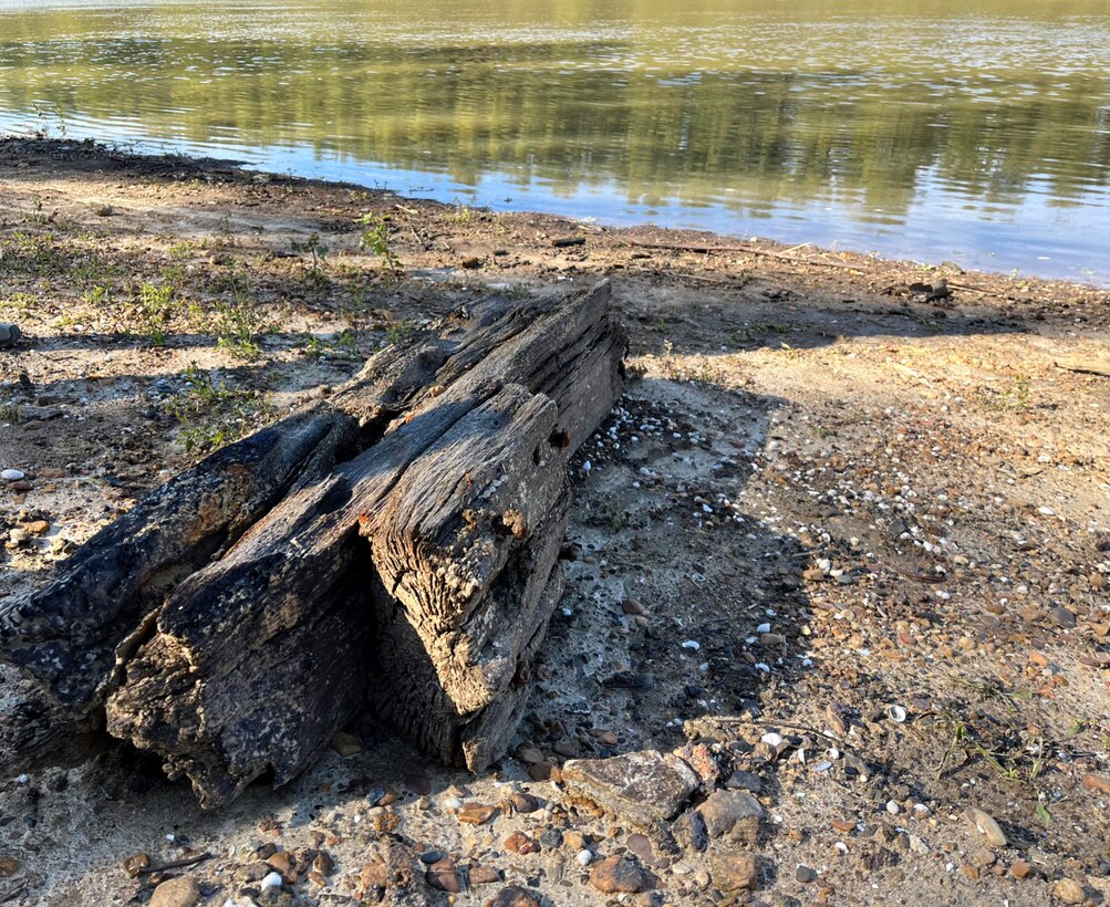 A piece of the tugboats keel is the only piece that remains above water on the Yazoo Canal during a site visit on Nov. 22. Recent rainfall has since covered up the rest of the wreck.