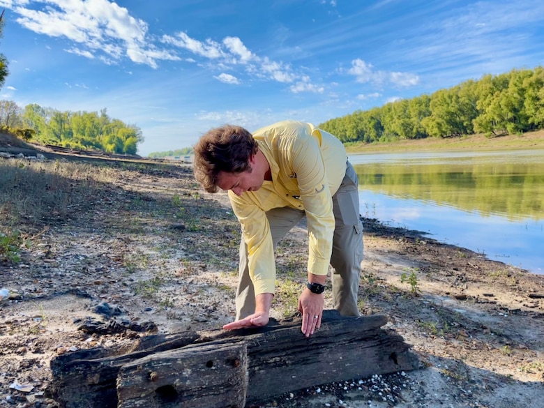 USACE Vicksburg District archeologist Kad Henderson examines a piece of the shipwreck's keel on the banks of the Yazoo Canal in Vicksburg, Mississippi, on Nov. 22.