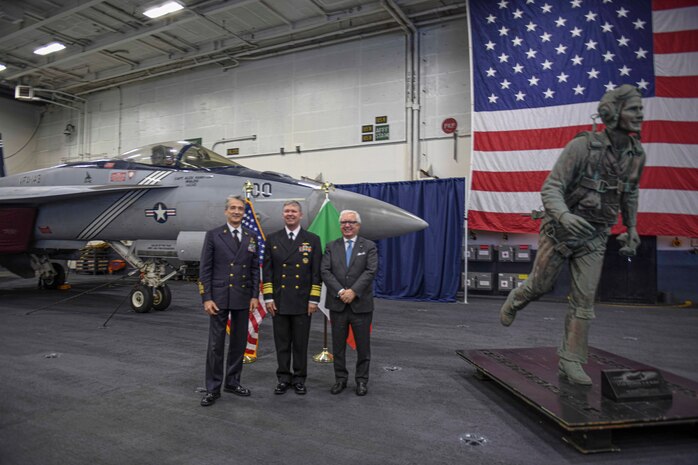 From left to right, Italian Head of Navy Adm. Enrico Credendino, Vice Adm. Thomas E. Ishee, commander, U.S. Sixth Fleet and Naval Striking and Support Forces NATO, and Italian Ministry of Defense Strategic Advisor Prof. Andrea Margelleti, pose for a photo after a reception for local military and civilian leaders, honoring the U.S.–Italian relationship aboard the Nimitz-class aircraft carrier USS George H.W. Bush (CVN 77) during a scheduled port visit, Nov. 29, 2022.