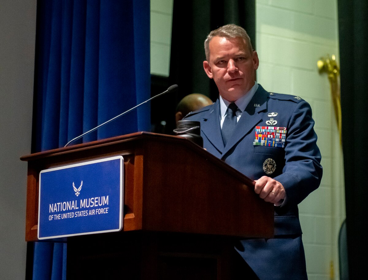 Man in Air Force uniform speaks at a podium.
