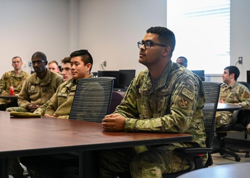 Tech. Sgt. Brandon Miller, 11th Civil Engineer Squadron power production supervisor, listens to a speech given by U.S. Air Force Col. Catherine “Cat” Logan, commander of Joint Base Anacostia-Bolling and the 11th Wing, before being awarded a Strips for Exceptional Performers promotion, Nov. 23, 2022, at JBAB, Washington D.C. The STEP program allows commanders an opportunity to immediately promote enlisted Airmen who exhibit exceptional potential beyond their rank. (U.S. Air Force photo by Airman Bill Guilliam)