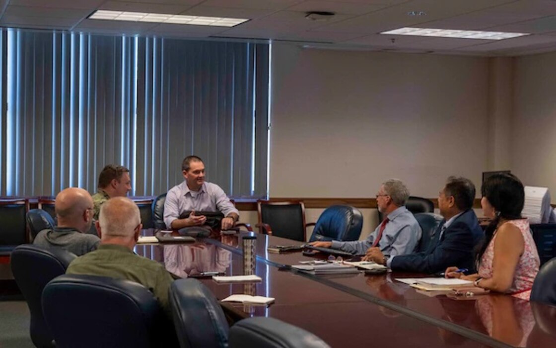 220908-N-PW480-0010 GREAT LAKES, Ill. (Sep. 8, 2022) – Director, MyNavyHR Enterprise Support (OPNAV N1) Manuel Hermosilla (center) speaks with Naval Service Training Command (NSTC) staff members during a visit onboard Naval Station Great Lakes, Sept. 8. Hermosilla met with NSTC departmental staff members to discuss changes and improvements to MyNavyHR N1 processes. NSTC is overseen by Rear Adm. Jennifer S. Couture and supports naval accessions training for 98 percent of the Navy’s new officers and enlisted Sailors. This training includes the Naval Reserve Officers Training Corps (NROTC) at more than 160 colleges and universities across the country, Officer Training Command (OTC) in Newport, Rhode Island, Recruit Training Command (RTC), the Navy’s only boot camp, as well as the Navy Junior Reserve Officers Training Corps (NJROTC) and Navy National Defense Cadet Corps (NNDCC) citizenship development program at more than 600 high schools worldwide. (U.S. Navy photo by Mass Communication Specialist 2nd Class Nikita Custer)