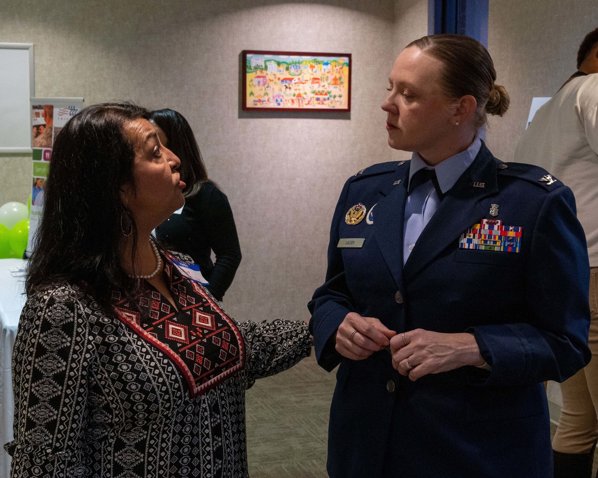 Sandra Saluda (left), Humana Military Health System manager, speaks with U.S. Air Force Col. Angela Lacek (Right), 47th Medical Group commander, on Nov. 16, 2022, at Laughlin Air Force Base, Texas. The Humana Military Open House gives an opportunity for military medical service providers and local medical service providers to connect and build a better understanding of how everyone operates. (U.S. Air Force photo by Senior Airman Nicholas Larsen)