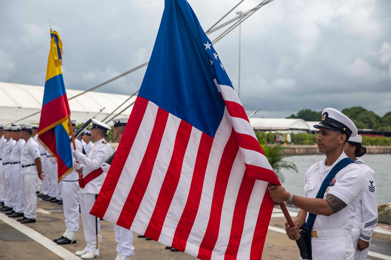 Sailors participate in a ceremony.