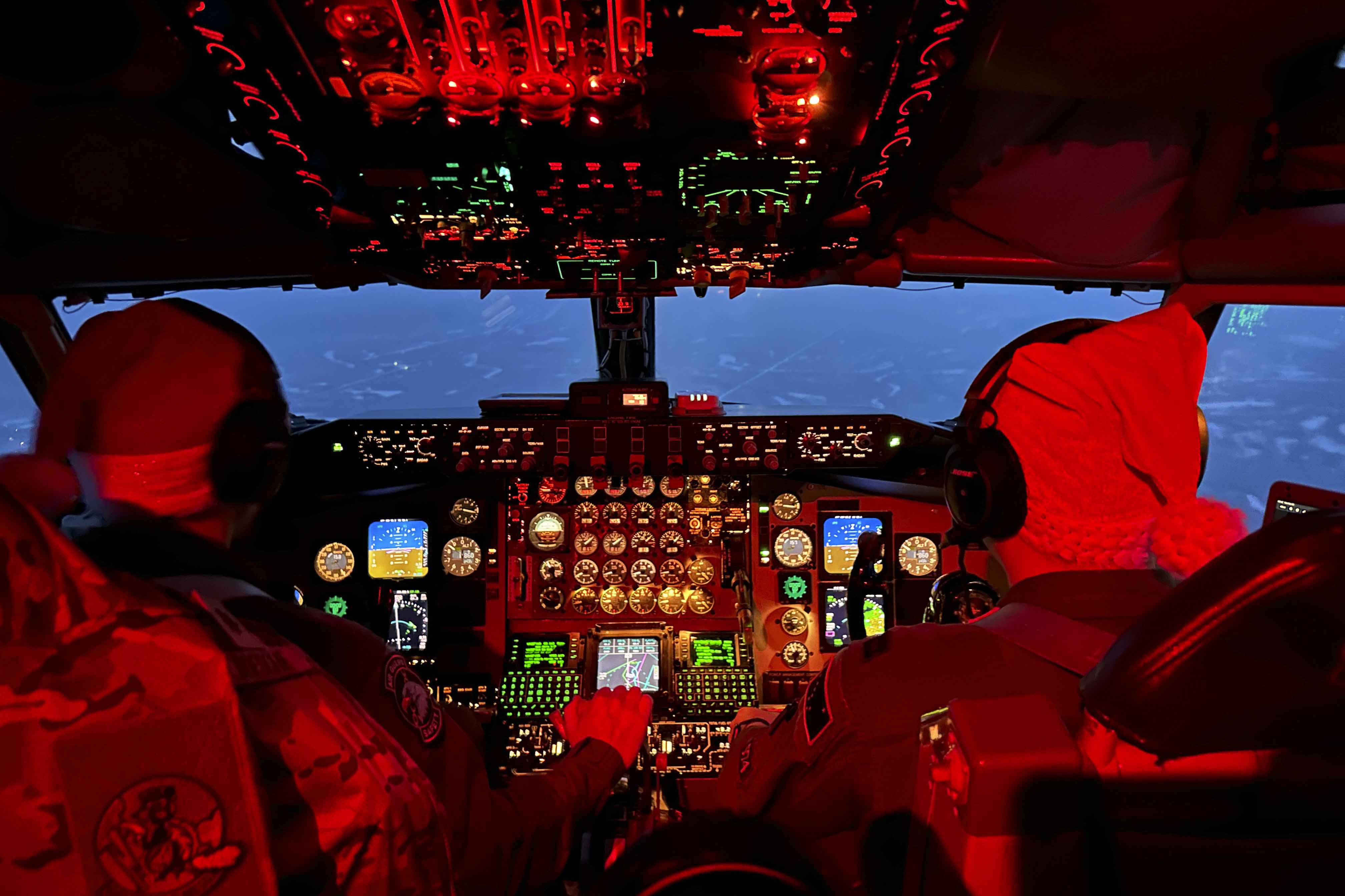 Two pilots fly with Santa Hats on