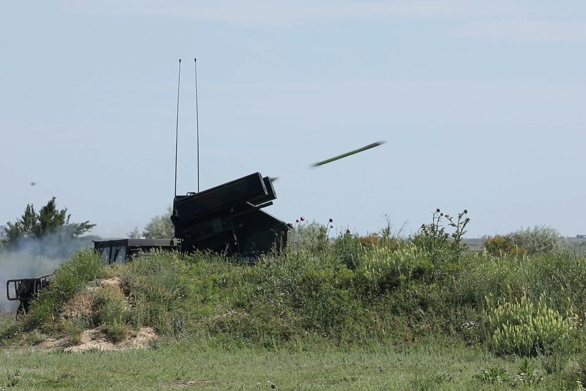 A large weapon fires a missile.