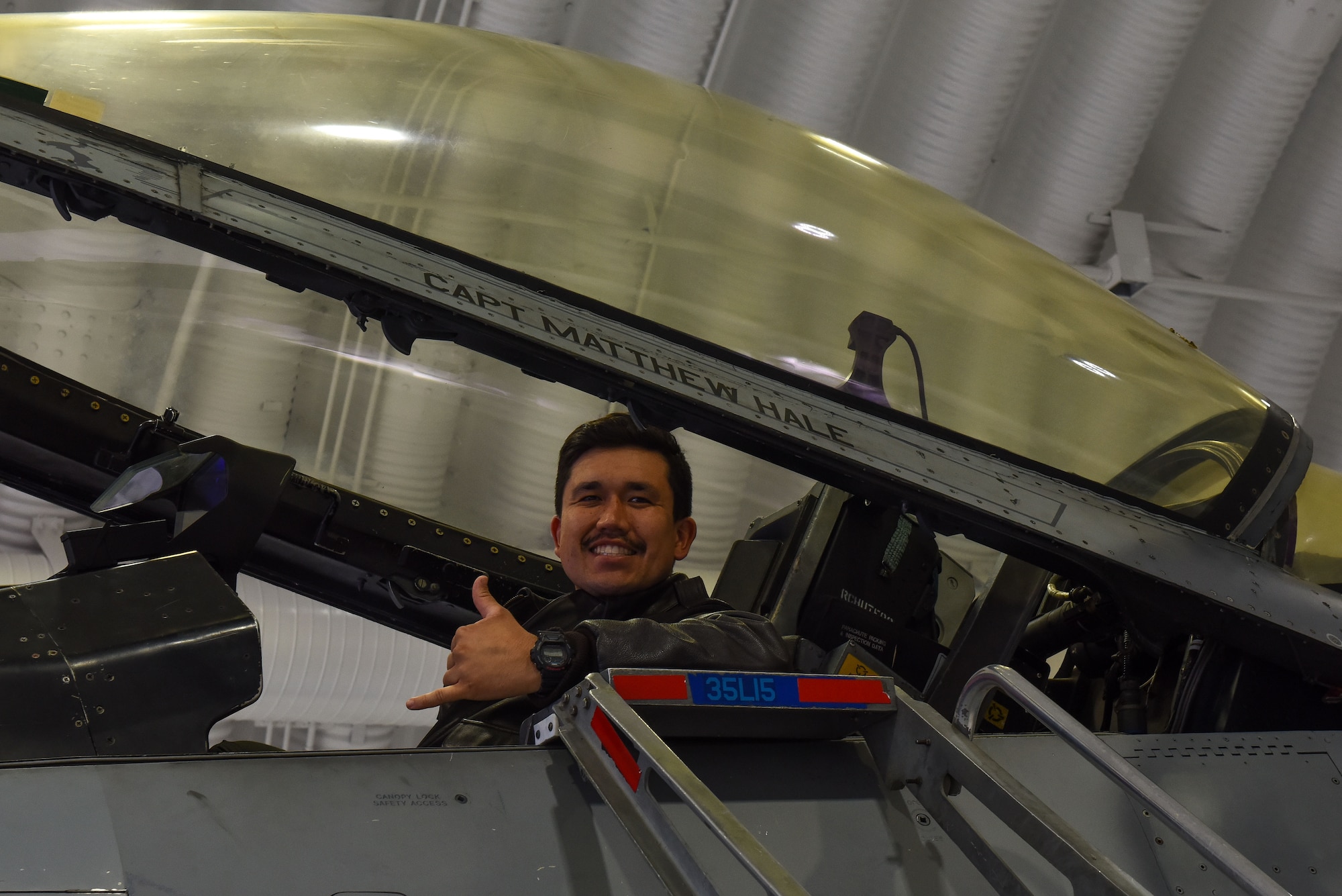 U.S. Air Force Capt. Matthew Hale, 35th Fighter Squadron pilot, sits in an F-16 Fighting Falcon that 
 bears his name on Kunsan Air Base, Republic of Korea, Nov. 23, 2022. Based on several different factors, a pilot can earn the right to have their name painted on one of their unit’s aircraft. (U.S. Air Force photo by Tech Sgt. Timothy Dischinat)