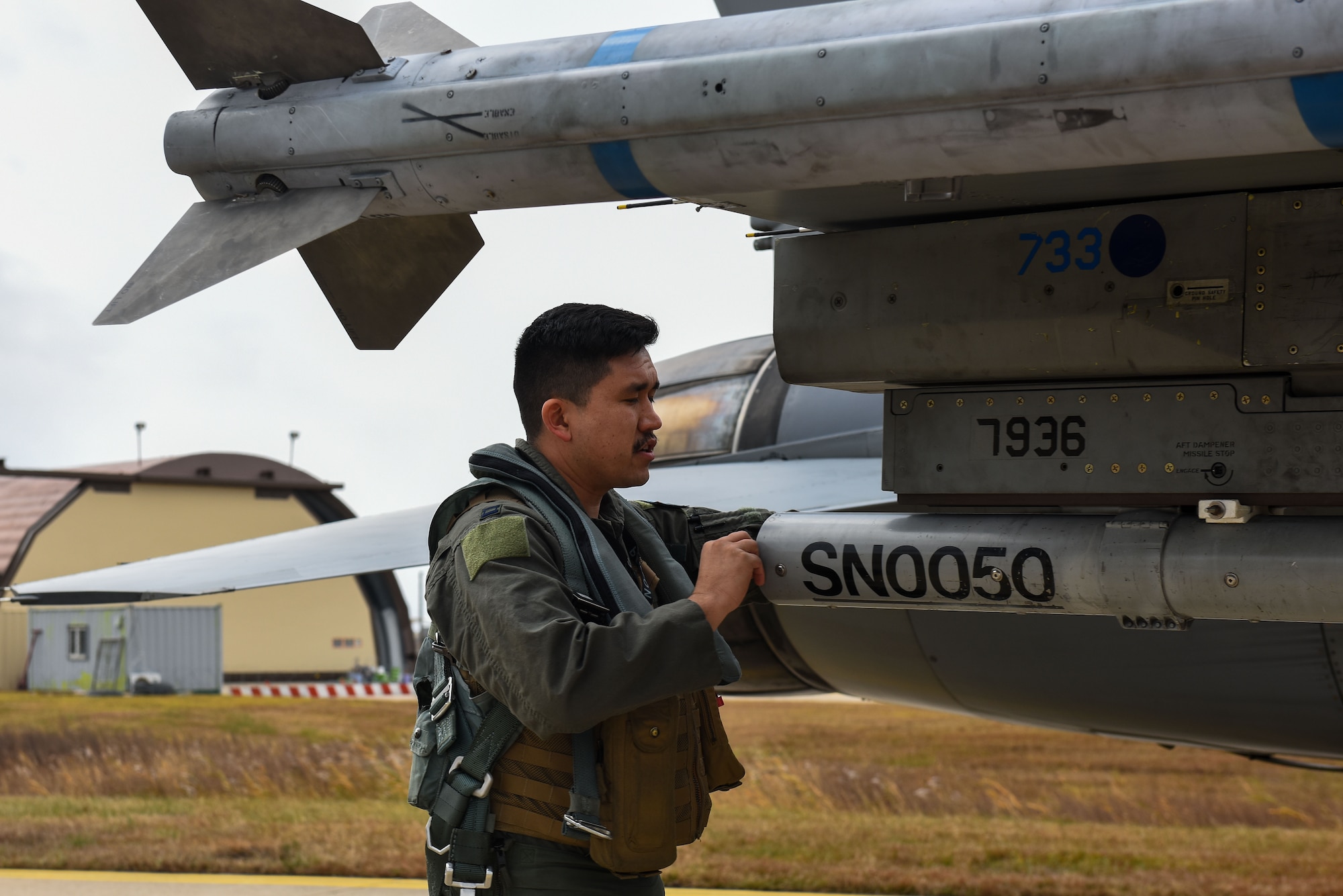 U.S. Air Force Capt. Matthew Hale, 35th Fighter Squadron pilot, conducts a post-flight check on an F-16 Fighting Falcon at Kunsan Air Base, Republic of Korea, Nov. 30, 2022. Hale, who is Native American, knew he wanted to be a pilot even at an early age. (U.S. Air Force photo by Tech Sgt. Timothy Dischinat)
