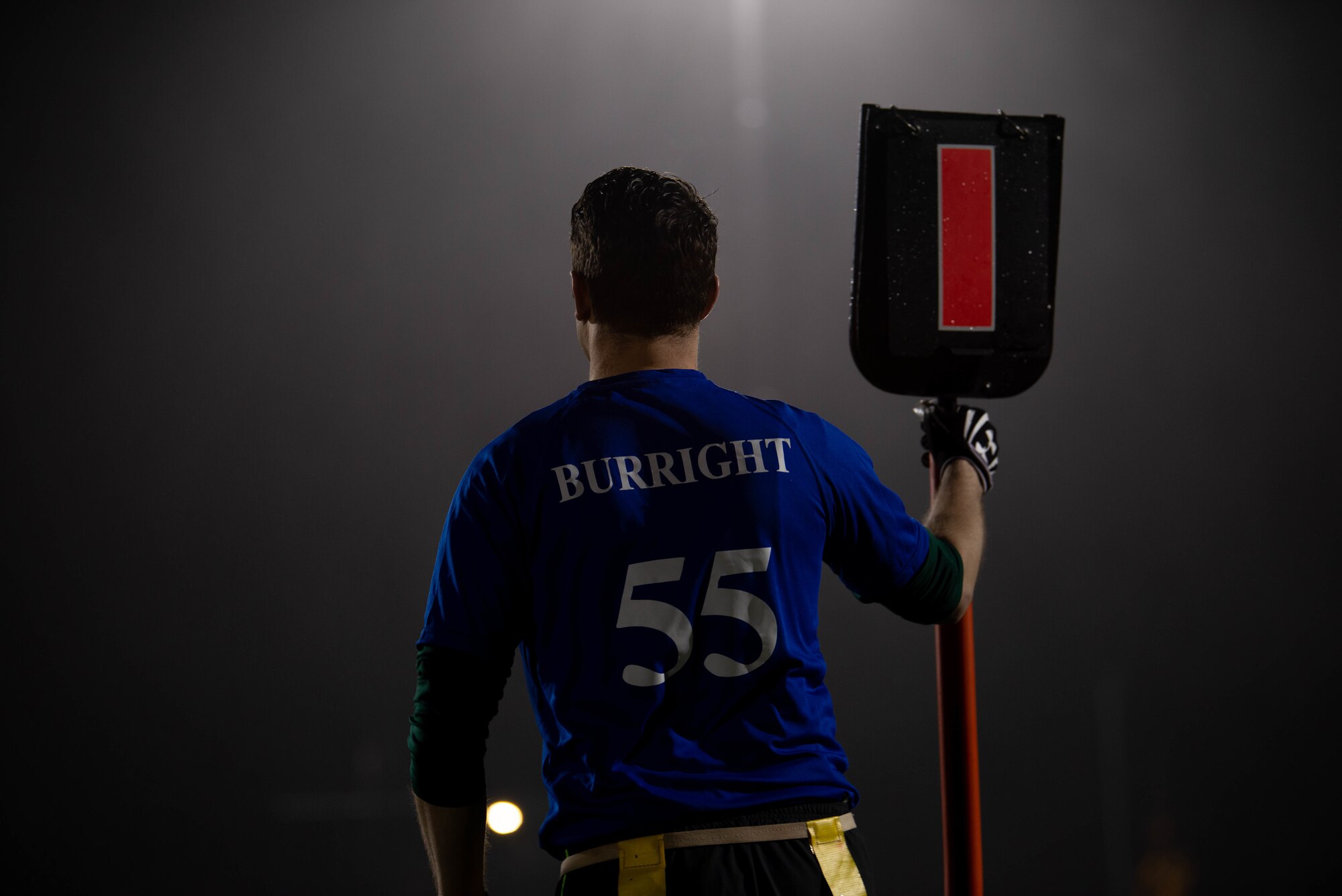 Team member stands with down marker