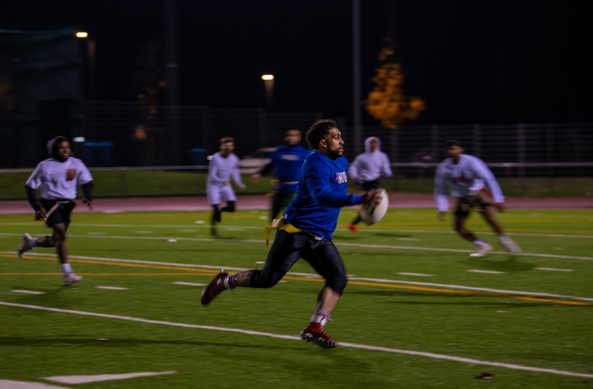 Flag football player runs with the ball