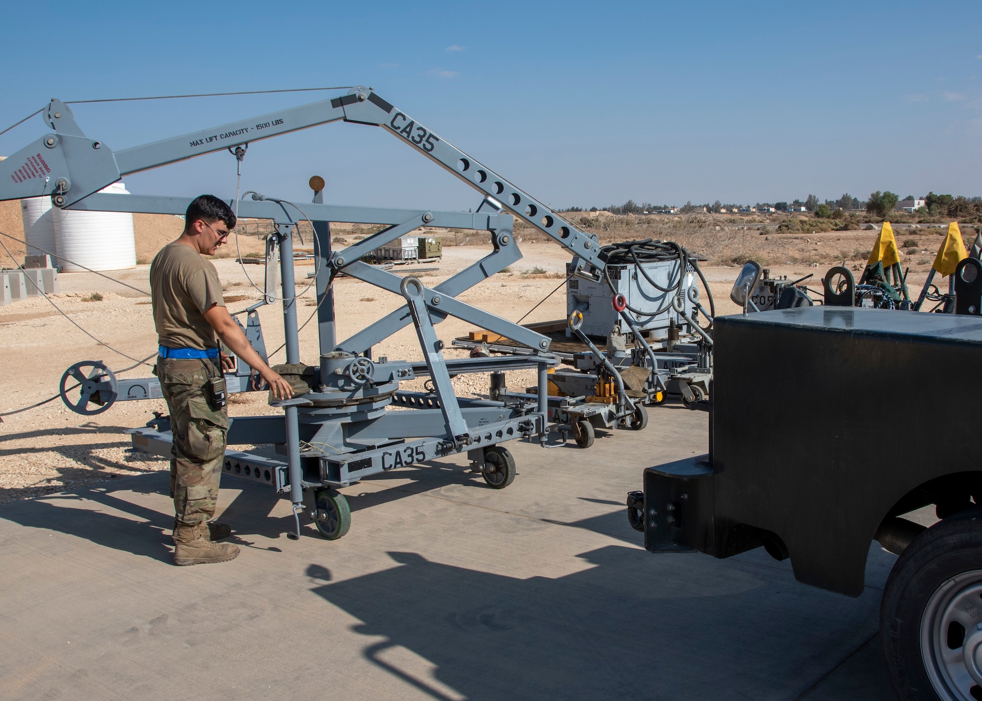 Senior Airman Jacob Karn, an Aerospace Ground Equipment Mechanic with the 332d Expeditionary Maintenance Squadron, inspects a canopy crane at an undisclosed location, Southwest Asia, Nov. 11. These cranes are used to remove the canopy of an F-15E Fighting Falcon for repairs. (U.S. Air Force photo by: Tech. Sgt. Jim Bentley)