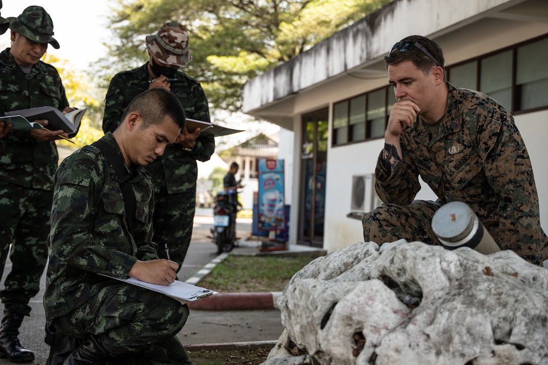 Sgt. Phanuwat Lohaporm, an Explosive Ordnance Disposal student with the Thailand Mine Action Center, determines the type and state of the ordnance during an EOD reconnaissance practical application drill at Fort Bhanurangsi, Ratchaburi, Thailand, November 17, 2022. Royal Thai and American Armed Forces work together to train TMAC students in EOD level 1-2 in order to develop an EOD capacity to assist TMAC’s mission of becoming landmine free. This partnership is aligned with the U.S. Department of Defense’s HMA Program, which assists partnered nations affected by landmines, explosive remnants of war, and the hazardous effects of unexploded ordnance.