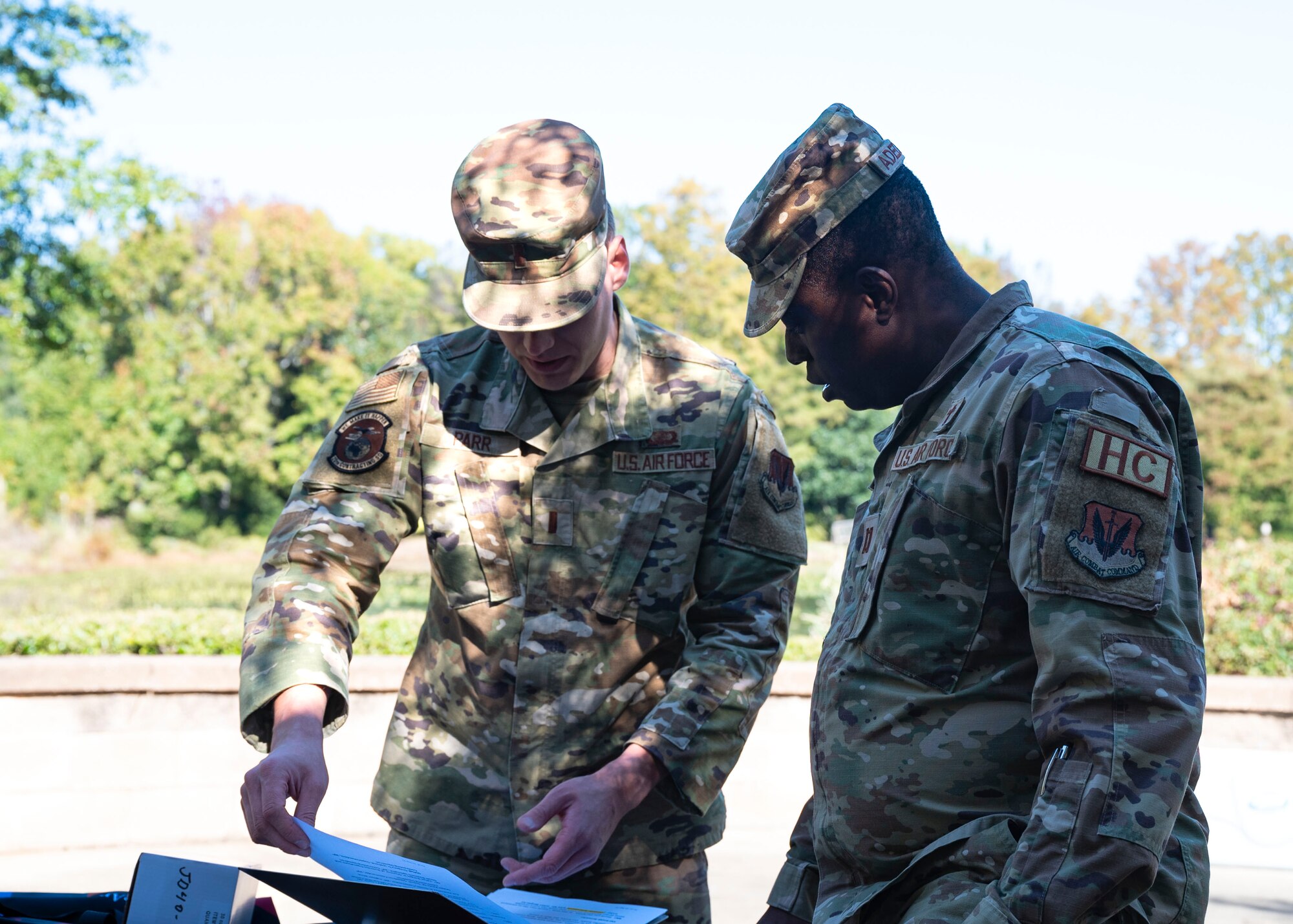 AbilityOne event coordinator reviews document with 20th Fighter Wing chaplain