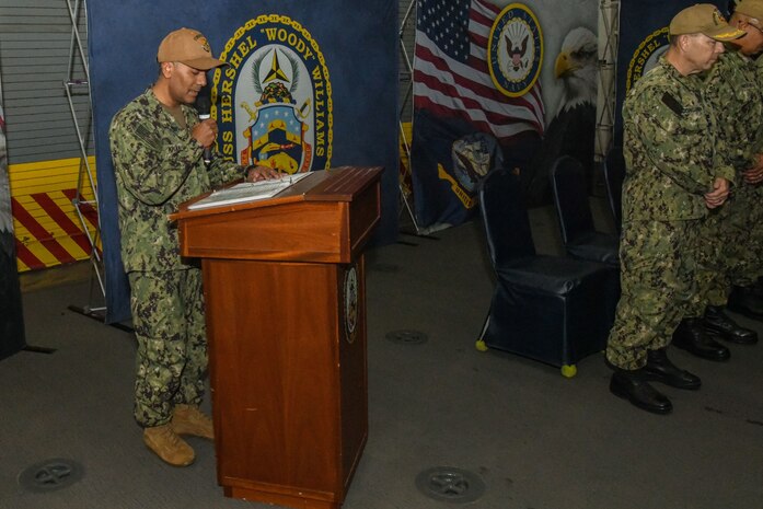 WALVIS BAY, Namibia (Nov. 25, 2022) U.S. Navy Sixth Fleet Chaplain, Lt. Ryan Khan, delivers the benediction during a change of command ceremony in the hangar bay of the expeditionary sea base USS Hershel "Woody" Williams (ESB 4) November 25, 2022. Hershel "Woody" Williams is on a scheduled deployment in the U.S. Naval Forces Africa area of operations, employed by U.S. Sixth Fleet to defend U.S., Allied and Partner interests. (U.S. Navy photo by Mass Communication Specialist 2nd Class Conner D. Blake/Released)