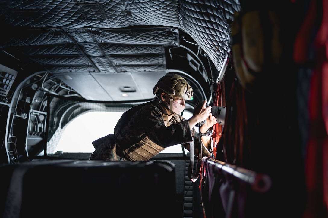 U.S. Marine Corps Cpl. Grace Gerlach, a combat videographer assigned to Communications Strategy and Operations Company, III Marine Expeditionary Force Information Group captures imagery during exercise Katana Strike at Kumejima, Okinawa, Japan, Oct. 24, 2022. COMMSTRAT's mission is to train and maintain deployable, task-organized teams that create still and video imagery products and support command element communications objectives.