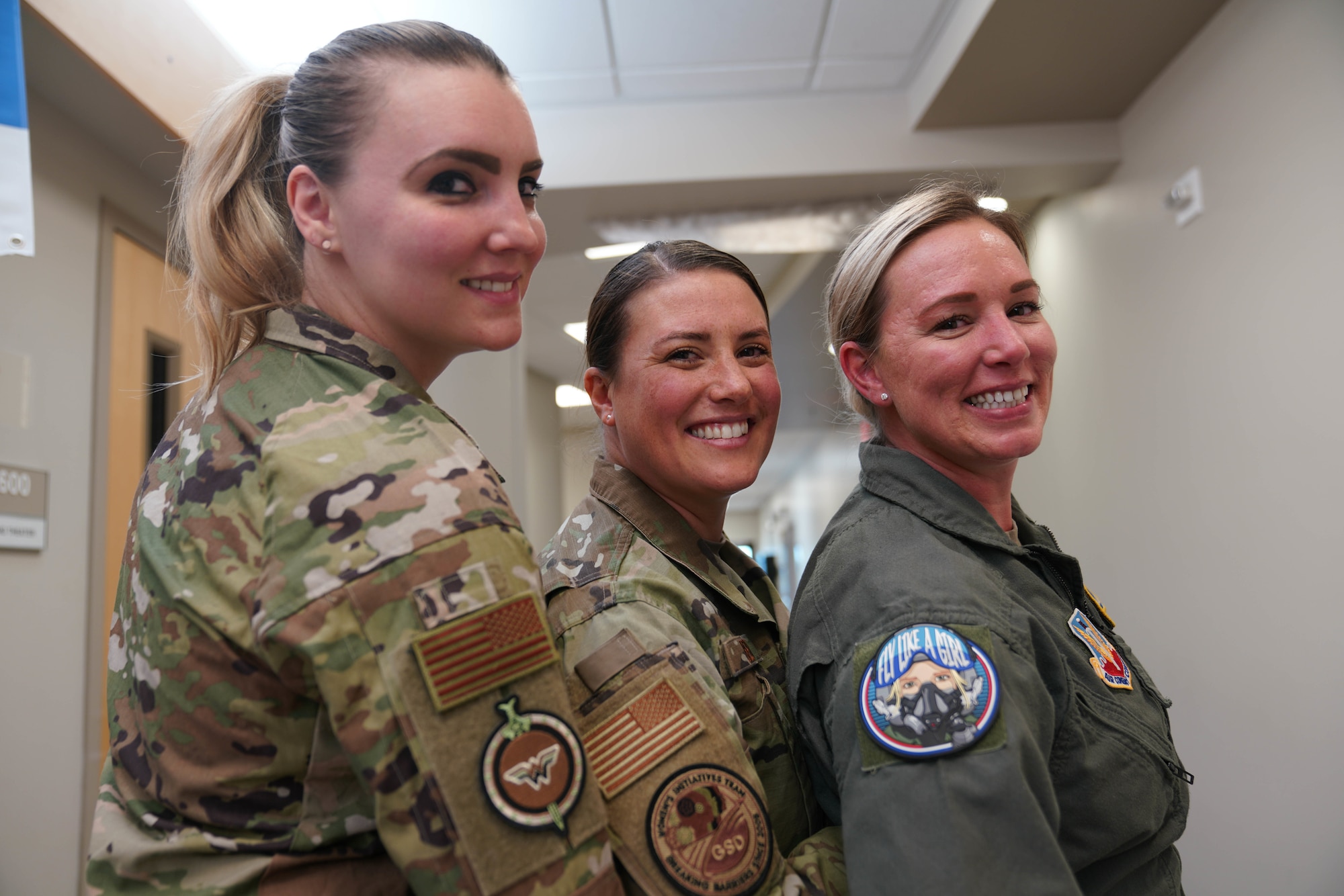 U.S. Air Force Women's Initiative Team (WIT) council members, assigned to the 432nd Wing, show off their WIT patches at Creech Air Force Base, Nev., Oct. 27, 2022. The WIT is composed of volunteers dedicated to identifying and eliminating barriers to women’s service in the Department of the Air Force and Department of Defense while building a community of leadership and a network of allies and support agencies. (U.S. Air Force photo by Airman 1st Class Ariel O'Shea)