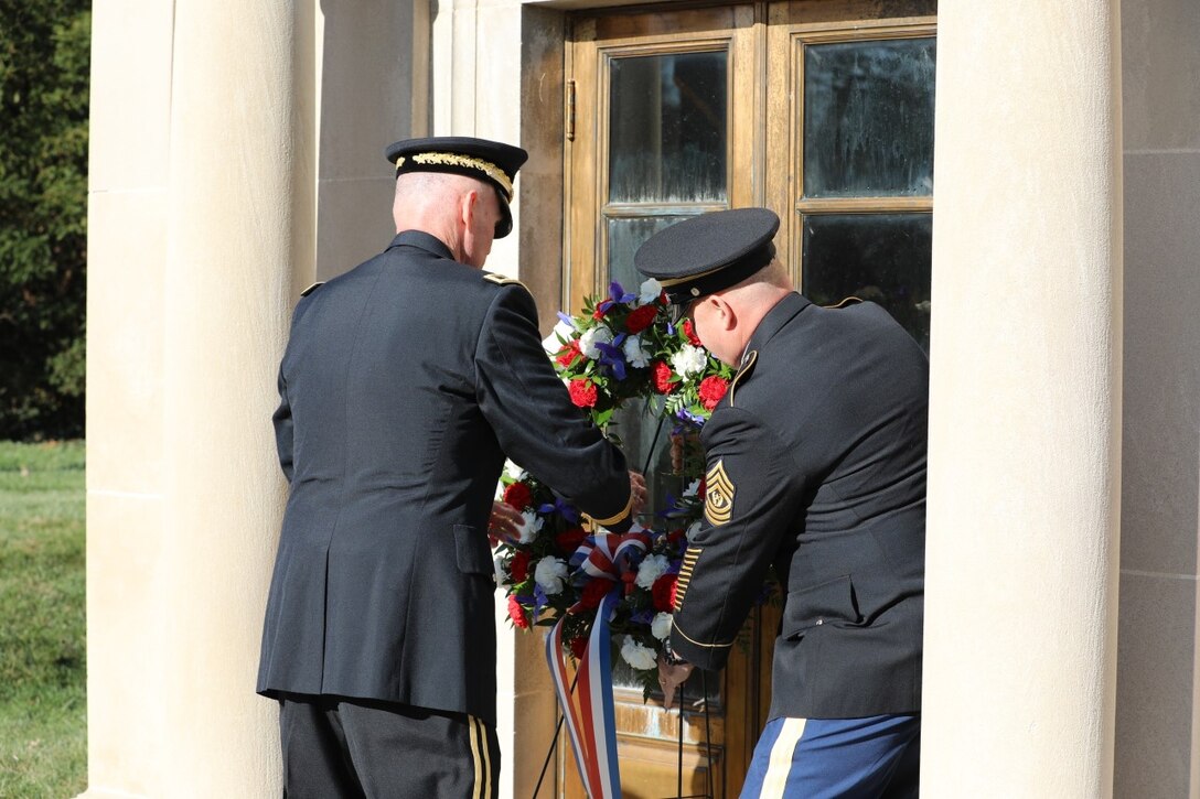Maj. Gen. Edward Merrigan and Command Sgt. Maj. Scott Hinton carefully place the presidential wreath at the Zachary Taylor mausoleum at the Zachary Taylor National Cemetery on November 23, 2022.