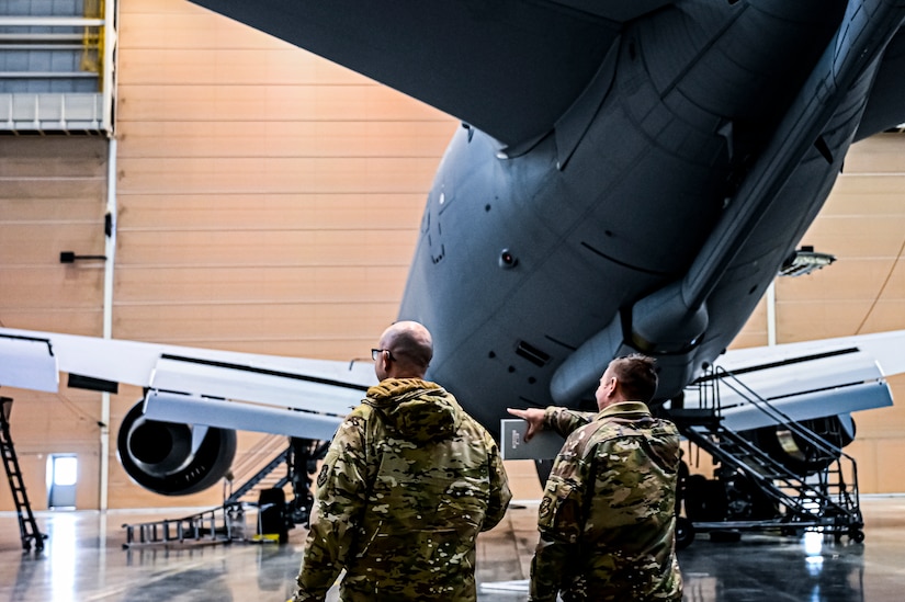 U.S. Air Force Master Sgt. Johnathan Ferguson, 305th Air Mobility Wing quality assurance inspector (Left), and U.S. Air Force Tech. Sgt. Chase Staron, 305th Air Mobility Wing crew chief (Right), perform a quality assurance inspection at Joint Base McGuire-Dix-Lakehurst, N.J. on Nov. 22, 2022. Ferguson is one of over one million registered bone marrow donors through the Department of Defense’s Salute to Life program. This year he met with the recipient of a donation he made in 2012 that allowed the patient to achieve remission of leukemia.