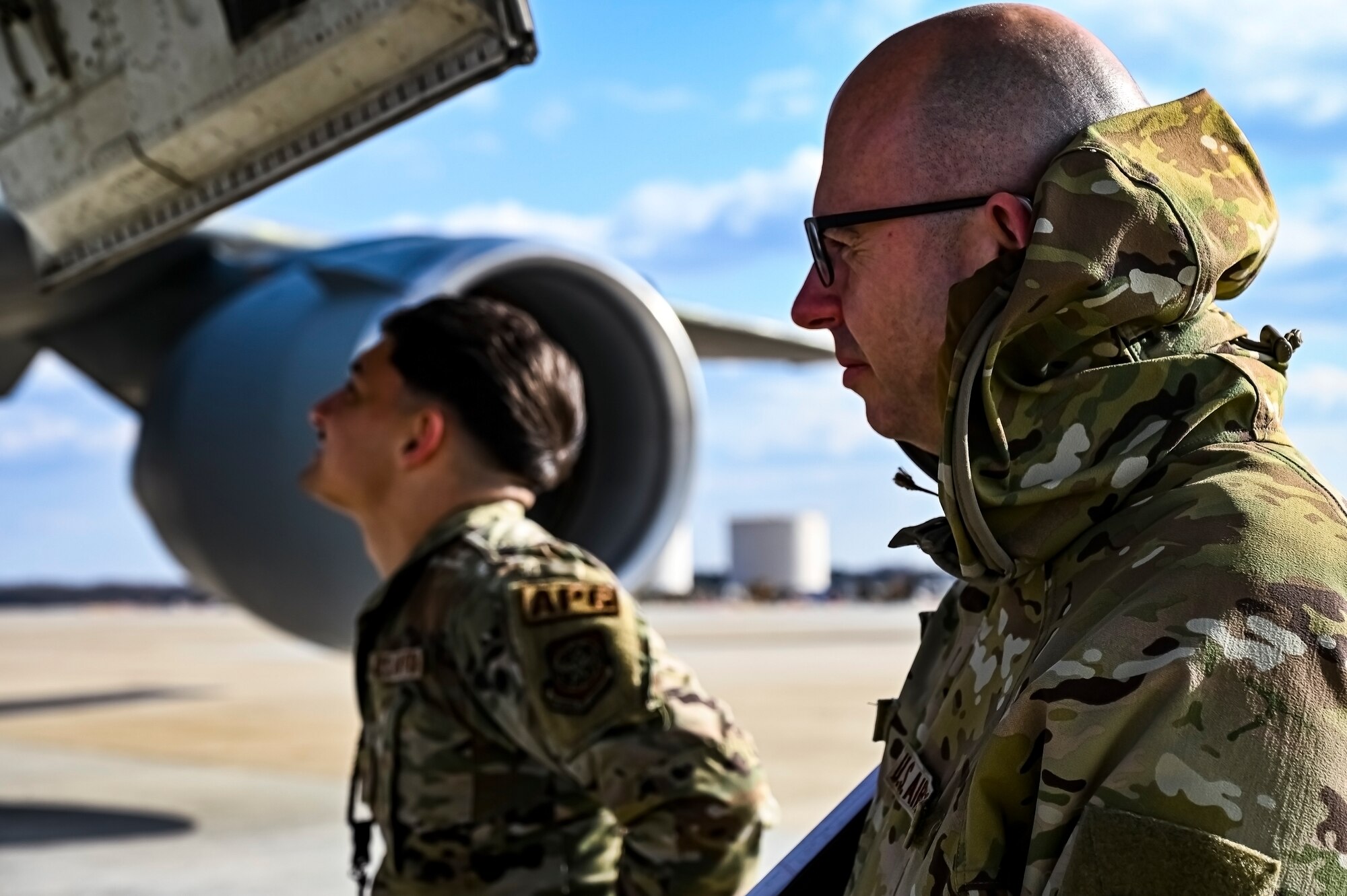 U.S. Air Force Master Sgt. Johnathan Ferguson, 305th Air Mobility Wing quality assurance inspector (Right), and U.S. Air Force Senior Airman Stephan Ramirez, 305th Air Mobility Wing crew chief, perform a quality assurance inspection at Joint Base McGuire-Dix-Lakehurst, N.J. on Nov. 22, 2022. Ferguson is one of over one million registered bone marrow donors through the Department of Defense’s Salute to Life program. This year he met with the recipient of a donation he made in 2012 that allowed the patient to achieve remission of leukemia.