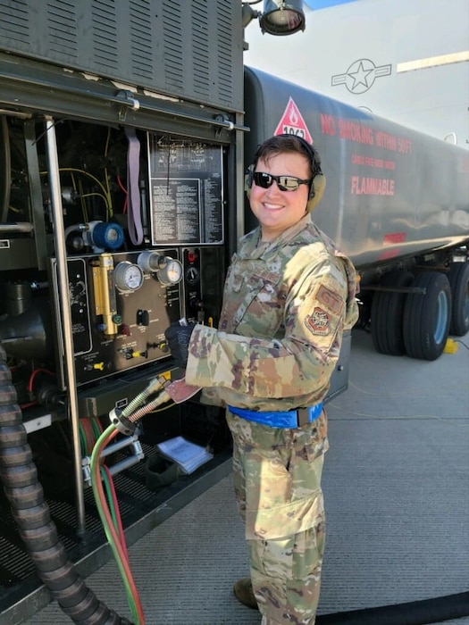 Airman refueling a plane.