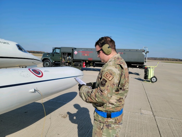Airman refueling a plane.
