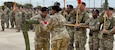 Col. David Newman, commander, 561st Regional Support Group based out of Omaha, Nebraska, accepts the colors of the Mobilization Support Brigade from III Armored Corps and Fort Hood Deputy Commanding General for Support (U.K.) Maj. Gen. Michael Keating, concluding the transfer of authority to Newman's unit from the 642nd RSG from Decatur, Georgia.