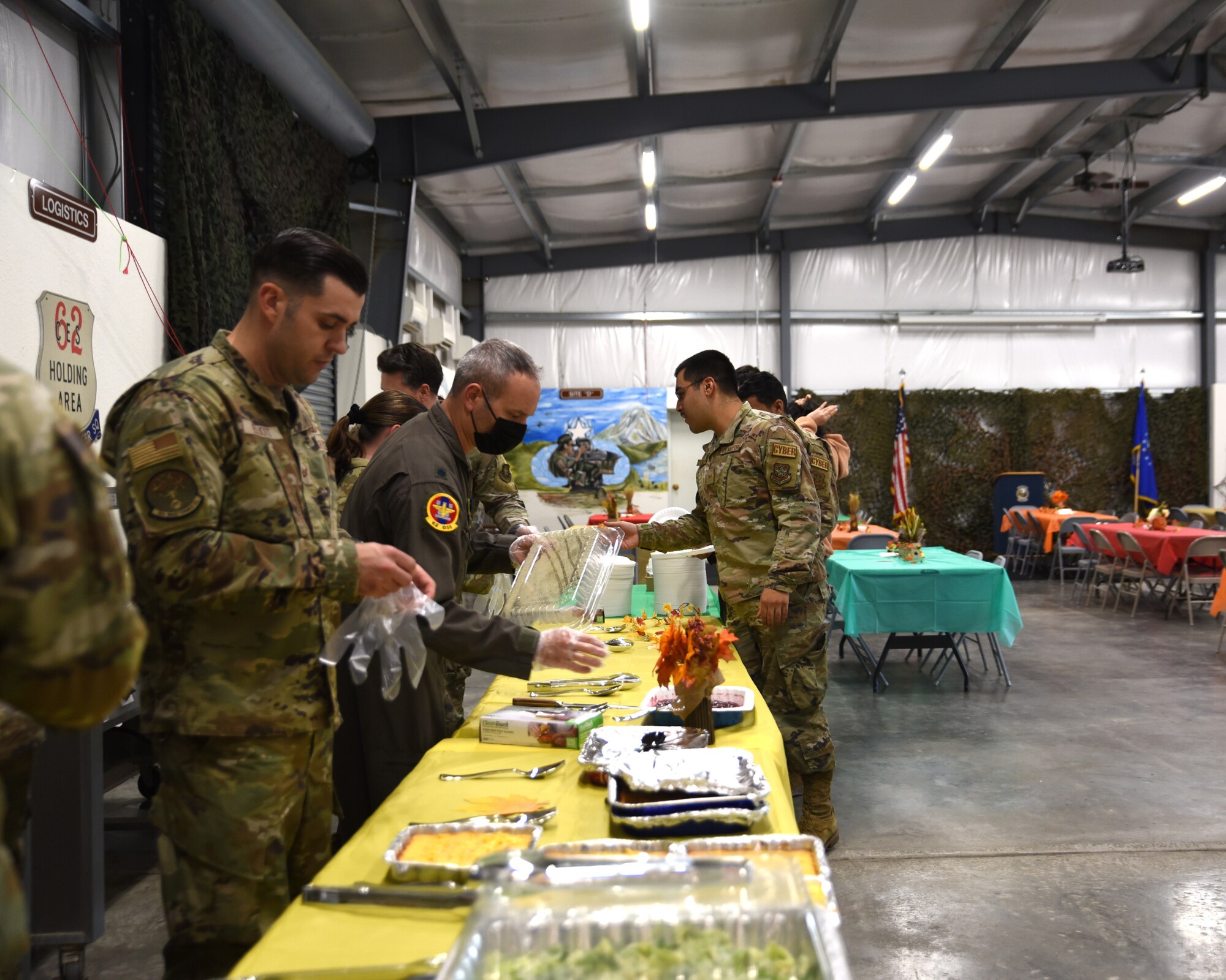 Team McChord first sergeants and leadership serve Airmen a variety of Thanksgiving food during the Dormsgiving Extravaganza at Joint Base Lewis-McChord, Washington, Nov. 17, 2022. Team McChord first sergeants hosted this event as a way to thank Airmen for their hard work and dedication to Team McChord. (U.S. Air Force photo by Airman Kylee Tyus)