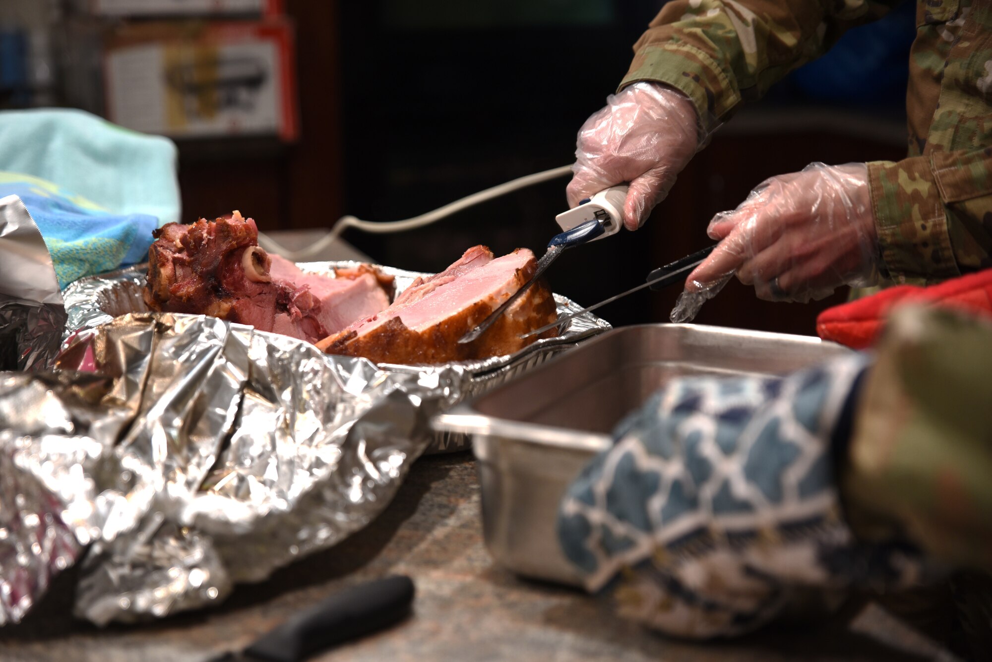 U.S. Air Force Team McChord first sergeants prepare food at the Dormsgiving Extravaganza at Joint Base Lewis-McChord, Washington, Nov. 17, 2022. Team McChord first sergeants hosted this event as a way to thank Airmen for their hard work and dedication to Team McChord. (U.S. Air Force photo by Airman Kylee Tyus)