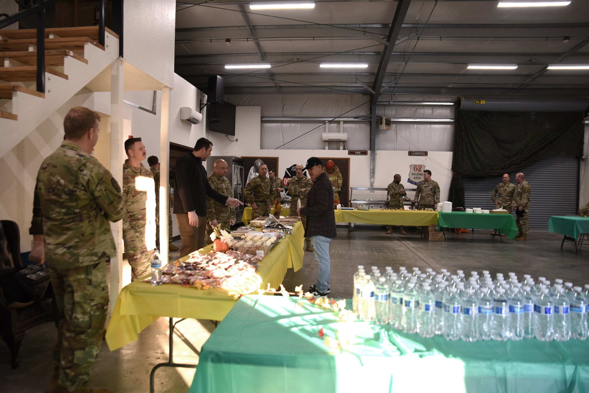 Team McChord first sergeants prepare and serve a variety of food during the Dormsgiving Extravaganza at Joint Base Lewis-McChord, Washington, Nov. 17, 2022. Team McChord first sergeants hosted this event as a way to thank Airmen for their hard work and dedication to Team McChord. (U.S. Air Force photo by Airman Kylee Tyus)