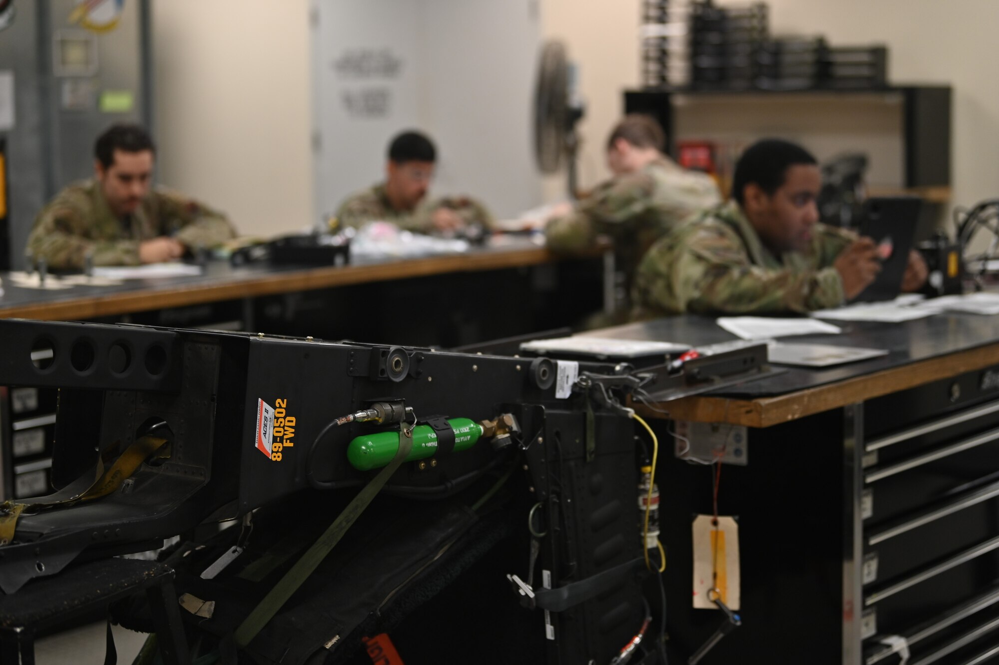 Airmen assigned to the 4th Component Maintenance Squadron inventory different components of an eject seat at Seymour Johnson Air Force Base, North Carolina, Nov. 8, 2022. Aircrew egress systems specialists are responsible for maintaining all necessary exit equipment on the aircraft ensuring pilots can safely eject from the F-15E Strike Eagle in the event of an emergency. (U.S. Air Force photo by Airman 1st Class Rebecca Sirimarco-Lang)