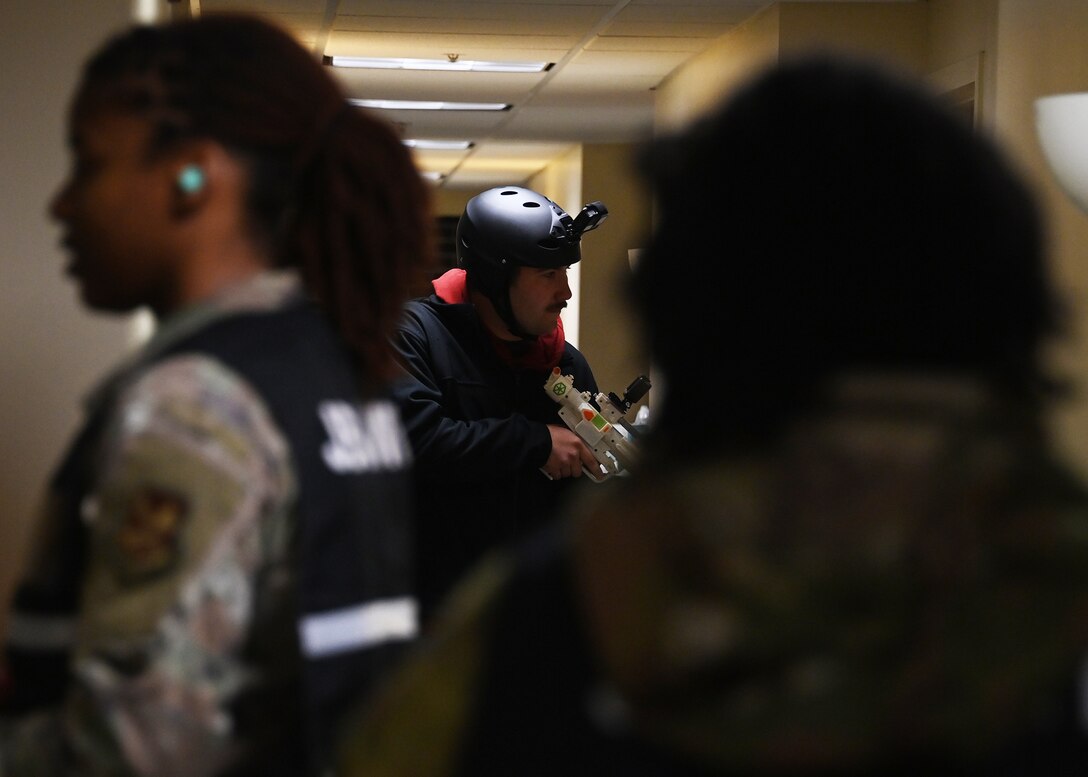 An Airman participates in an active shooter exercise at Joint Base Andrews, Md., Nov. 30, 2022. During the exercise, Airmen were evaluated on their actions, such as how they communicated with one another, tracked down the target(s) and attempted to save lives. (U.S. Air Force photo by Airman 1st Class Austin Pate)