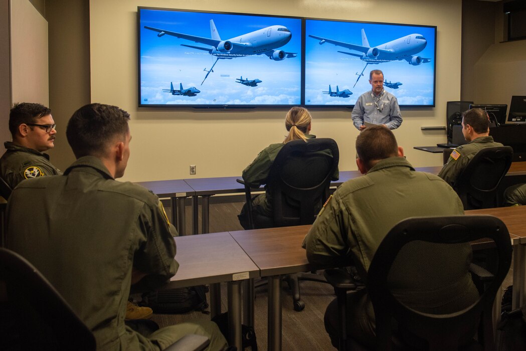 Nicola Borghini, KC-46 Pegasus lead pilot instructor, teaches KC-46 copilot students at Altus Air Force Base, Oklahoma, Nov. 29, 2022. The 56th Air Refueling Squadron students go through different phases during their training: classroom and computer-based training, simulator training, and flightline training. (U.S. Air Force photo by Airman 1st Class Kari Degraffenreed)