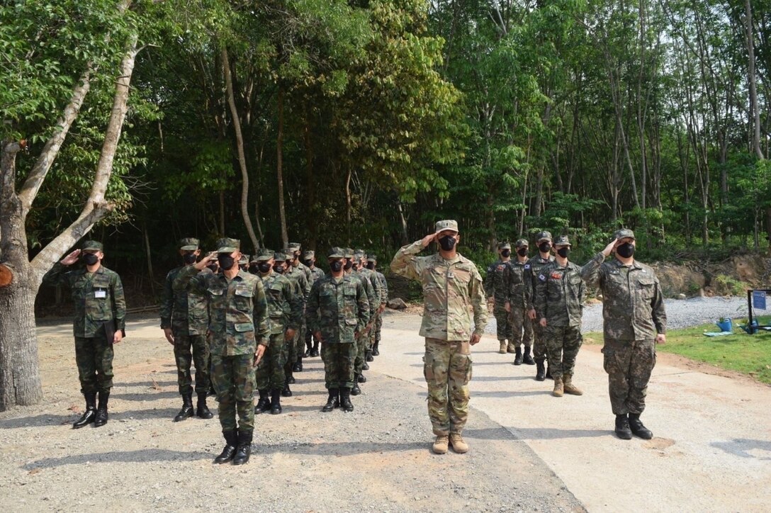 1st Lt. Apisit Meejaiyen salutes during the opening ceremony of Cobra Gold 2022. Meejaiyen, along with his platoon of U.S. Army Reserve Engineers partnered with engineers from the Royal Thai Navy and the Republic of Korea Navy to build a new annex to the Ban Khao Ta-In School in the Rayong Province of the Kingdom of Thailand, Feb. 28, 2022, as part of Cobra Gold 2022. CG 22 is the 41st iteration of the international training exercise that supports readiness and emphasizes coordination on civic action, humanitarian assistance, and disaster relief. From Feb. 22 through March 4, 2022, this annual event taking place at various locations throughout the Kingdom of Thailand increases the capability, capacity, and interoperability of partnered nations while simultaneously reinforcing our commitment to a free and open Indo-Pacific. (U.S. Army Reserve Photo by 1st Lt. Apisit Meejaiyen)