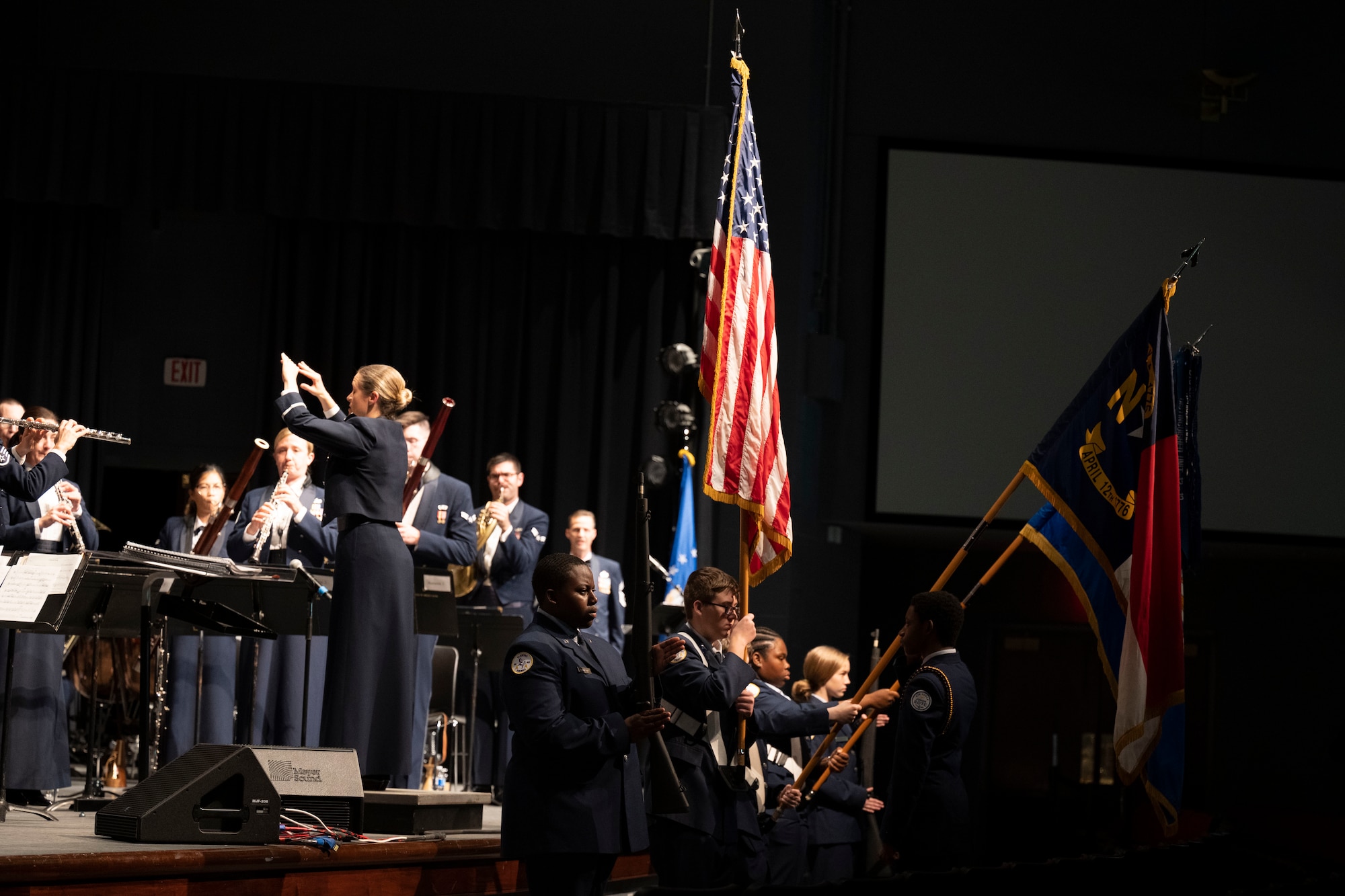 Chief Master Sgt. F. Charles Anderson, United States Air Force Heritage of America Band manager and emcee, announces the playing of the National Anthem during a Veteran’s Day concert at Edgecombe Community College in Tarboro, North Carolina, Nov. 9, 2022. The Heritage of America Band honors all who have served in the United States Armed Forces by commemorating the contributions of the nation's veterans; past and present, both at home and in deployed locations around the world. (U.S. Air Force photo by Senior Airman Kevin Holloway)