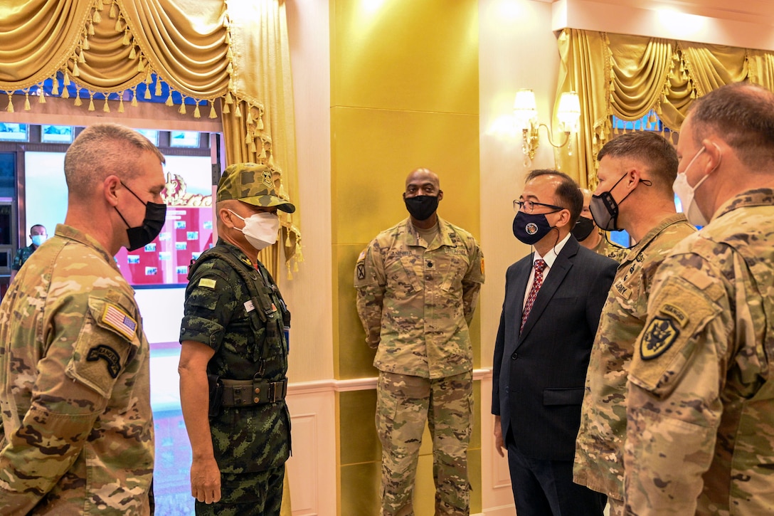 Army Maj. Gen. Joseph Ryan, second from the right, the commanding general of the 25th Infantry Division, meets with Mr. Michael Heath, third from the right, the Chargé d’ Affaires a.i. of the U.S. Mission in Thailand, and Gen. Narongpan Jitkaewthae, second from the left, the commander-in-chief of the Royal Thai Army, before the opening ceremony of Hanuman Guardian 2022 at the Infantry Center, Khao Noi, Kingdom of Thailand, Feb. 24, 2022. Hanuman Guardian 2022 is the 11th iteration of the annual bilateral U.S. Army Pacific Theater Security Cooperation Program event conducted with the Royal Thai Army in coordination with United States Indo-Pacific Command. As part of the Pacific Pathways series, the goal of HG22 is to foster closer relationships, increase readiness, and enhance interoperability among service members of the U.S. Army and Royal Thai Army. (U.S. Army photo by Danielle O'Donnell)