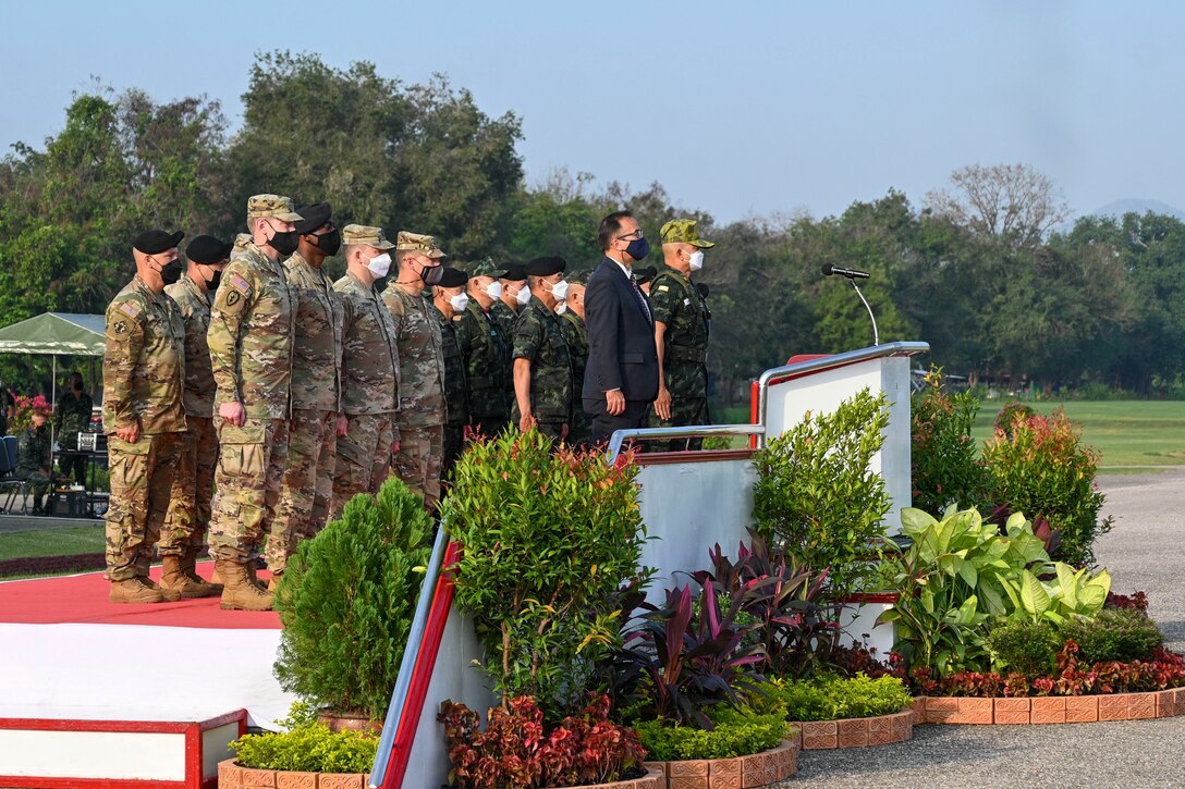 Key Leaders with the U.S. Army and the Royal Thai Army stand at attention during the opening ceremony for Hanuman Guardian 2022 at the Infantry Center, Khao Noi, Kingdom of Thailand, Feb. 24, 2022. Hanuman Guardian 2022 is the 11th iteration of the annual bilateral U.S. Army Pacific Theater Security Cooperation Program event conducted with the Royal Thai Army in coordination with United States Indo-Pacific Command. As part of the Pacific Pathways series, the goal of HG22 is to foster closer relationships, increase readiness, and enhance interoperability among service members of the U.S. Army and Royal Thai Army. (U.S. Army photo by Danielle O'Donnell)