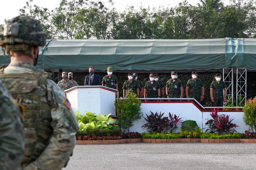 A U.S. Soldier stands in formation as Mr. Michael Heath, the Chargé d’ Affaires a.i. of the U.S. Mission in Thailand, gives remarks at the opening ceremony for Hanuman Guardian 2022 at the Infantry Center, Khao Noi, Kingdom of Thailand, Feb. 24, 2022. Hanuman Guardian 2022 is the 11th iteration of the annual bilateral U.S. Army Pacific Theater Security Cooperation Program event conducted with the Royal Thai Army in coordination with United States Indo-Pacific Command. As part of the Pacific Pathways series, the goal of HG22 is to foster closer relationships, increase readiness, and enhance interoperability among service members of the U.S. Army and Royal Thai Army. (U.S. Army photo by Danielle O'Donnell)