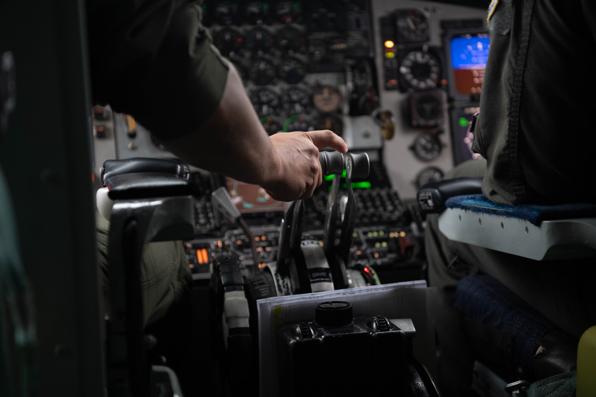 An Airman starts an aircraft's engines.