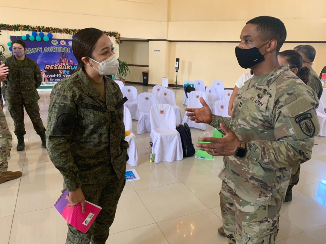 Capt. James Jordan, 5th Security Force Assistance Brigade Medical Logistics Advisor, discusses Medical Logistics systems with Philippine Army Capt. Simon during an engagement with the Philippine Army at Fort Bonifacio, Manila on Mar. 3, 2022. The engagement preceded the Salaknib training at Fort Magsaysay, and enabled Medical Advisors to meet with Philippine counterparts who were unable to attend the Salaknib training helping the Advisors to tailor their training to the capabilities of the Philippine Army.