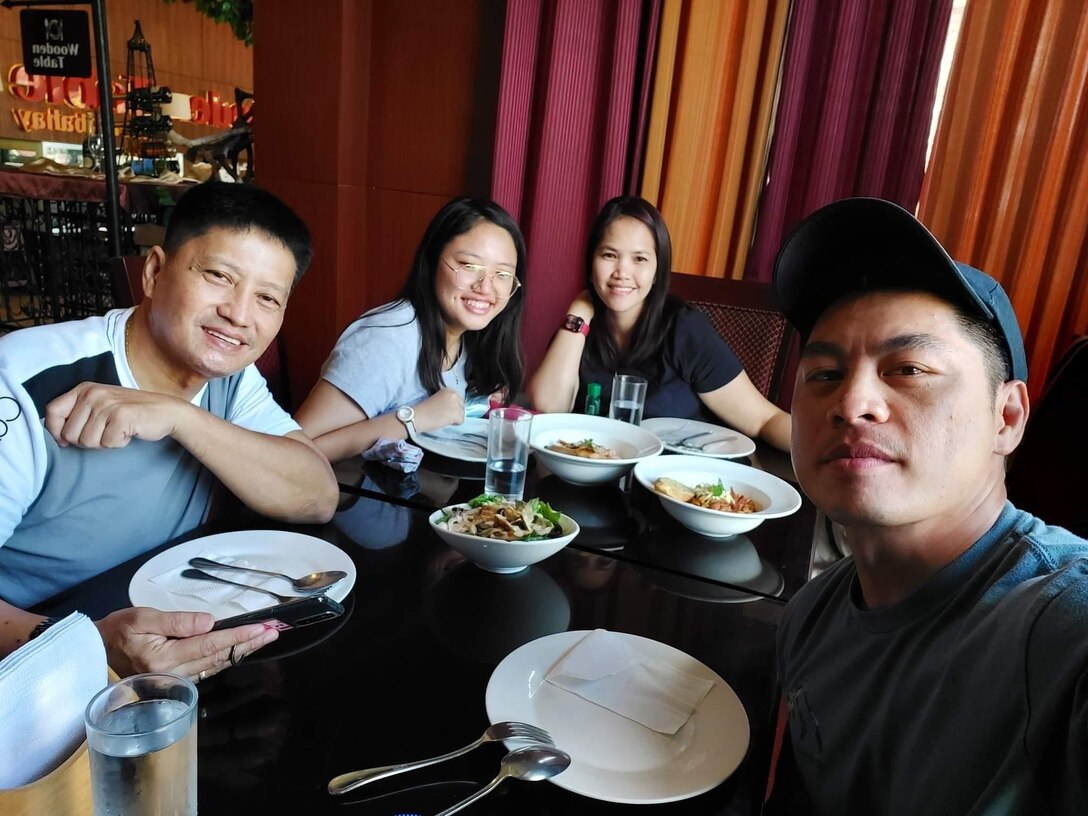 Staff Sgt. Michael Bamba, Maneuver Advisor Team 5333, Force Package 22-1-I, 5th Security Force Assistance Brigade with his brother, sister-in-law, and niece during his visit to Angeles City earlier this year as MAT 5333 travelled to the Philippines to participate in combined interoperability training.